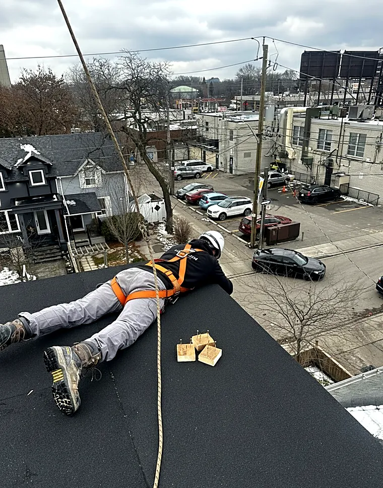 ABI crew member measuring on a rooftop